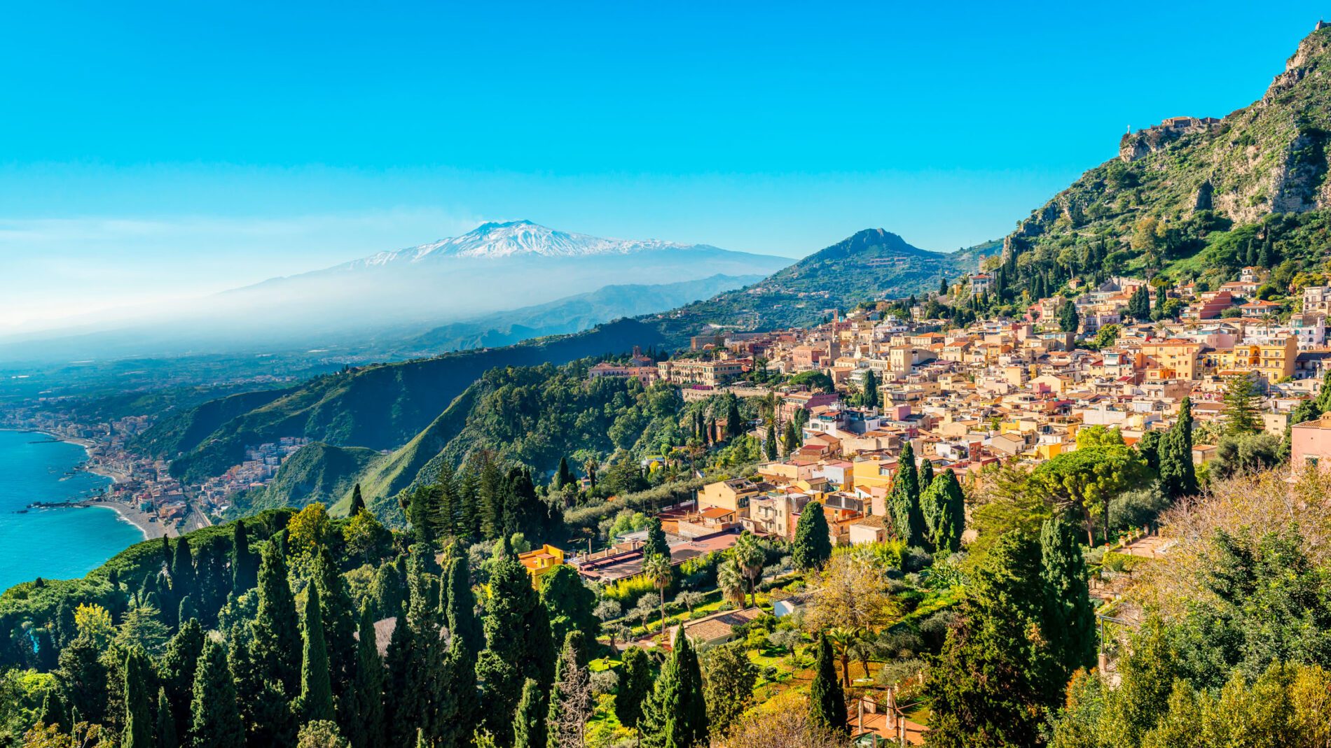 A panoramic view of Taormina, Giardini Naxos and Mount Etna, in