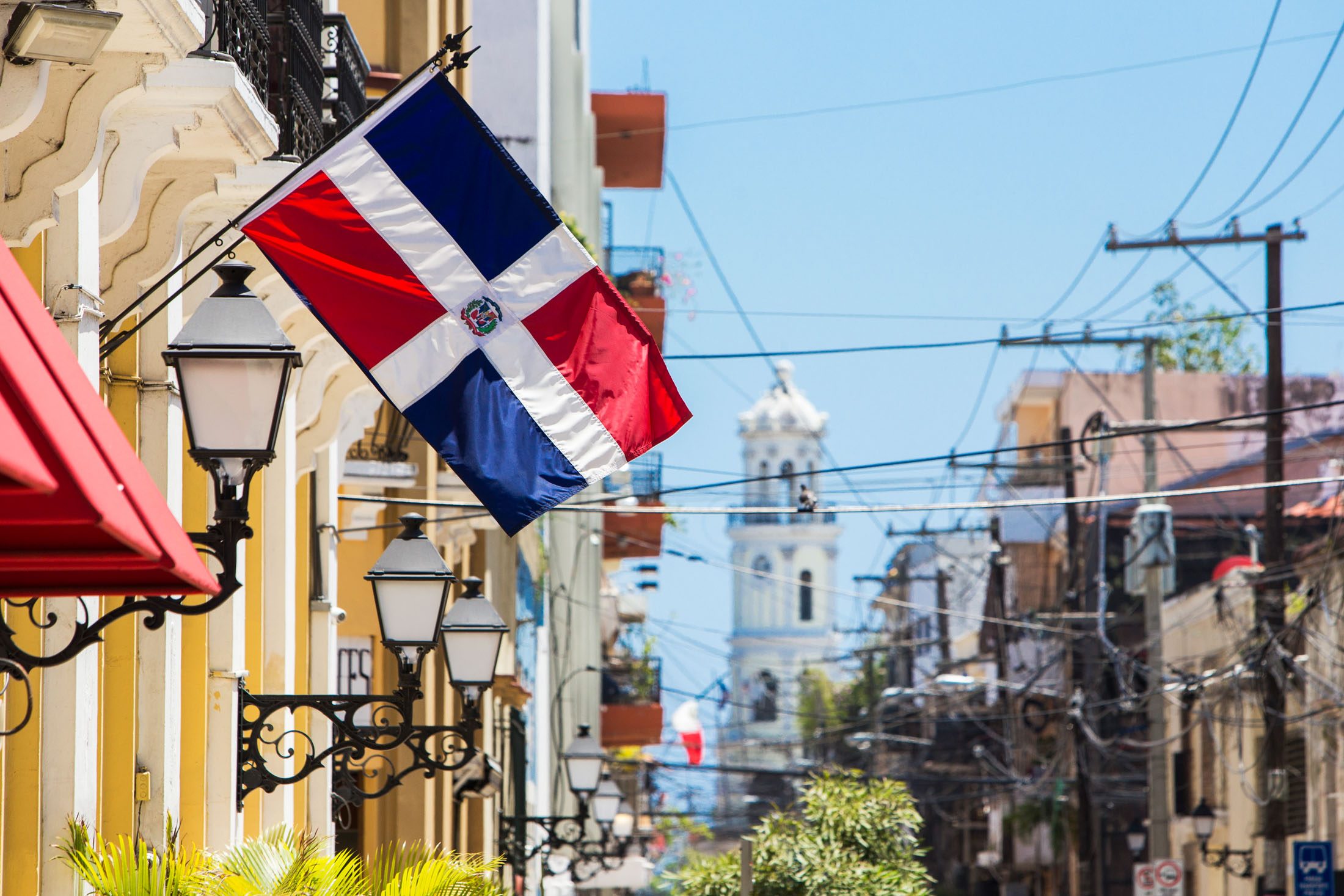 Arzobispo Merino street. Santo domingo. Flag of the Dominican Re